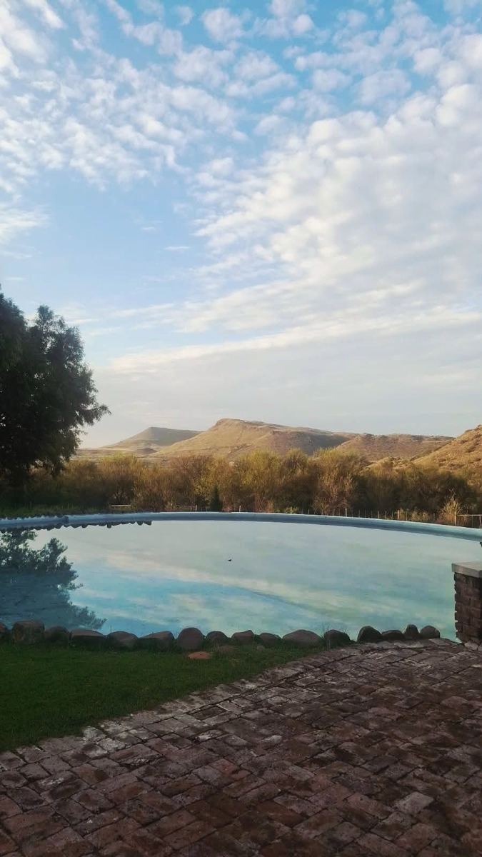 Pool with sky reflection